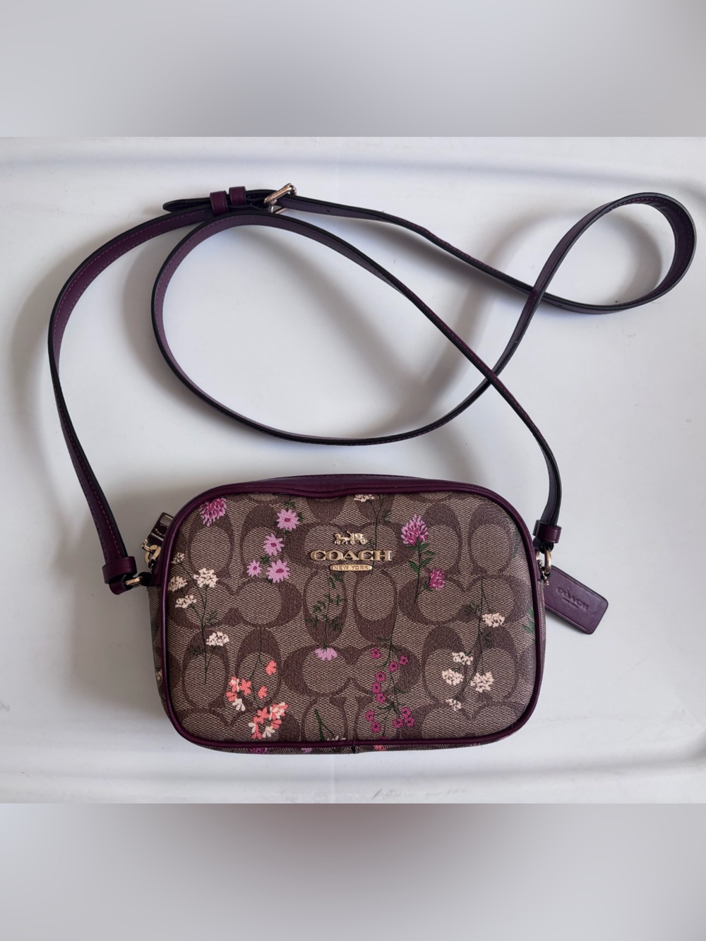 Coach Brown Signature Floral Crossbody with maroon trim